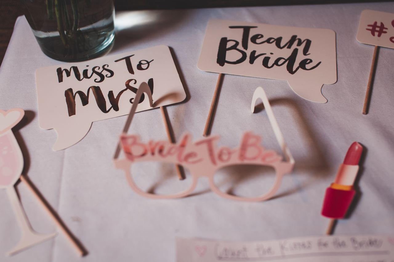 services-06 Flat lay of bridal shower decorations with creative signs and props.