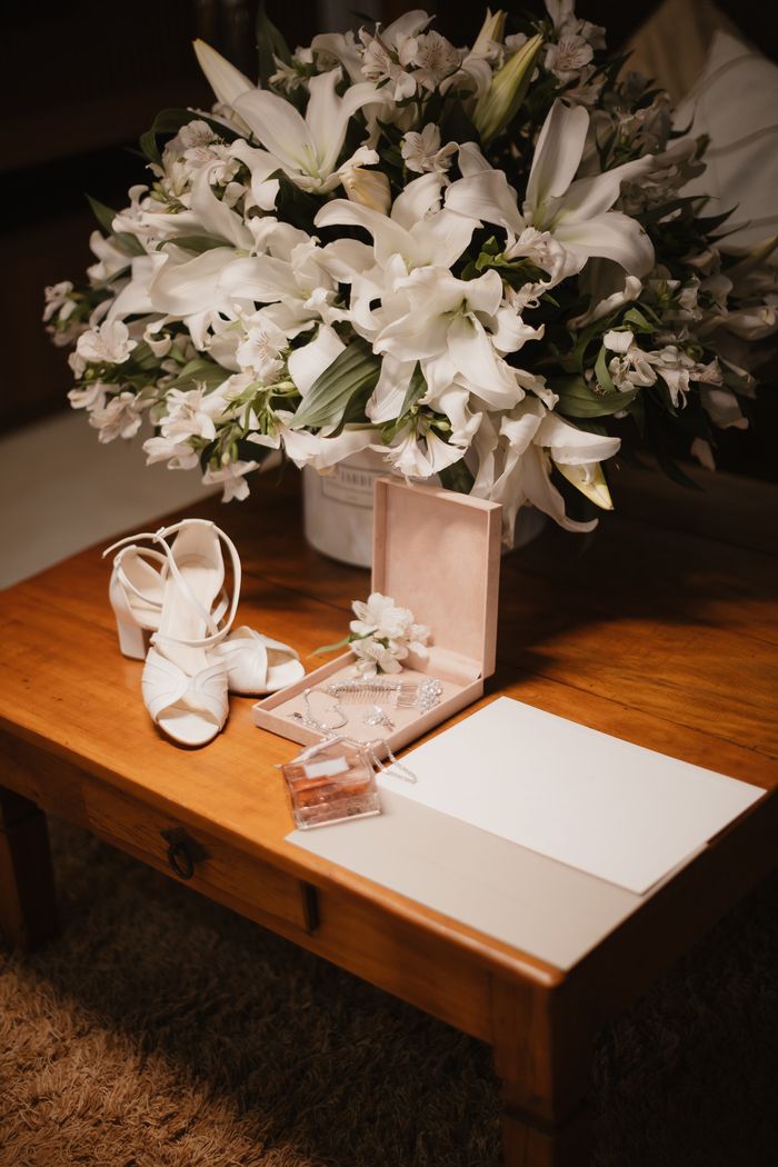 services-04 Beautiful wedding accessories with a white lily bouquet on a table, perfect for a classic ceremony.