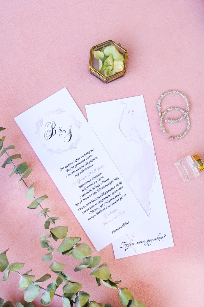 services-01 Chic wedding invitations with decor on soft pink surface, perfect for romantic occasions.